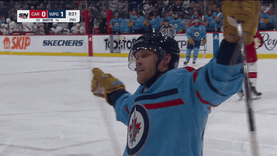 Hockey Player Number 27 Holding Hockey Stick GIF