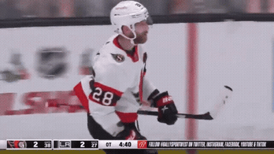 Hockey Player Number 28 Hugging Another Player GIF