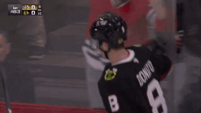 Hockey Player Number 29 Hugging Another Player GIF
