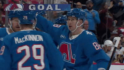 Hockey Player Number 29 Surrounded By Teammates GIF