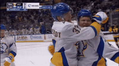 Hockey Player Number 33 Hugging Teammate GIF
