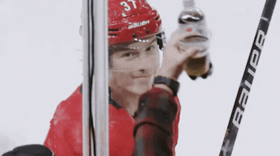 Hockey Player Number 37 Holding Bauer Stick GIF