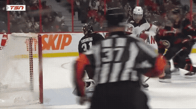 Hockey Player Number 37 In Front Of Skip Sign GIF