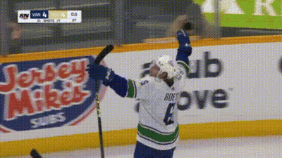 Hockey Player Number 4 Holding Stick GIF