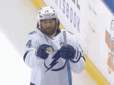 Hockey Player Number 4 Holding Stick GIF