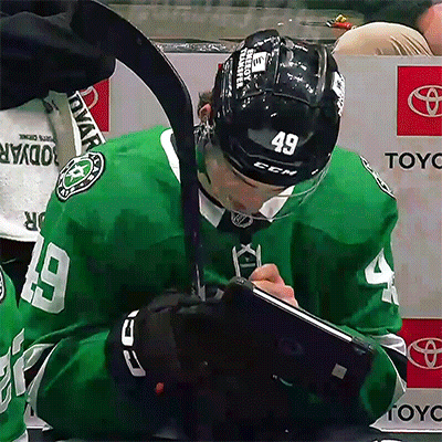 Hockey Player Number 49 Writing On Clipboard GIF