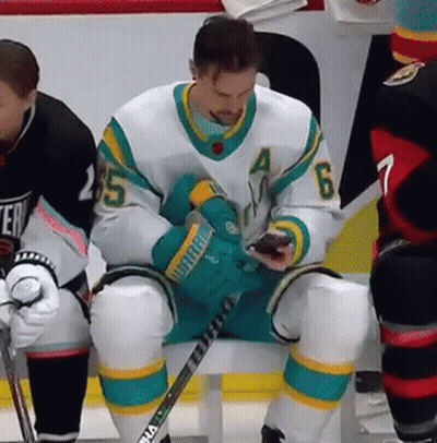 Hockey Player Number 6 Looking At Phone GIF