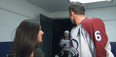 Hockey Player Number 6 Talking To Woman GIF