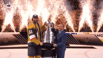 Hockey Player Number 61 Holding Trophy GIF