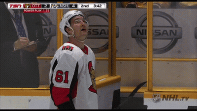 Hockey Player Number 61 In Front Of Nissan Logo GIF