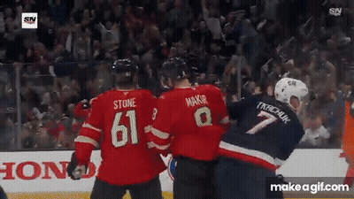 Hockey Player Number 61 Next To Referee GIF