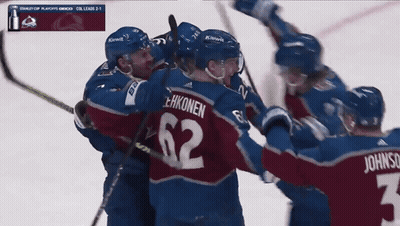 Hockey Player Number 62 Surrounded By Teammates GIF