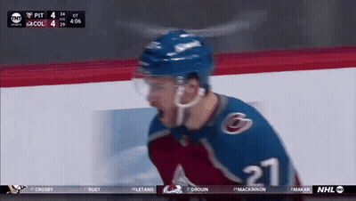 Hockey Player Number 62 Surrounded By Teammates GIF