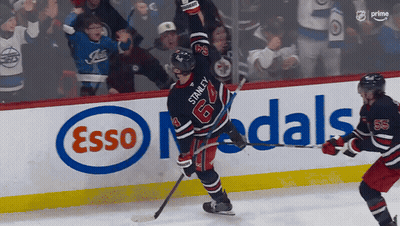 Hockey Player Number 64 In Front Of Esso Ad GIF