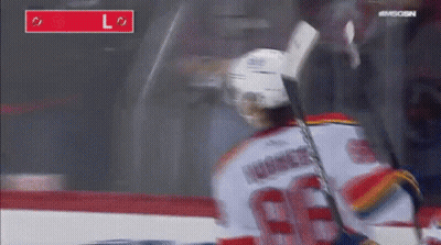 Hockey Player Number 66 Holding Stick GIF