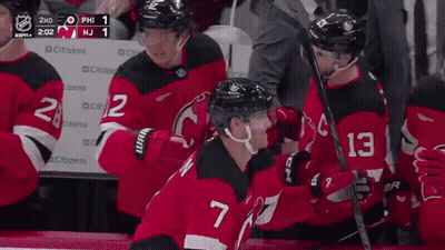Hockey Player Number 7 Hugging Another Player GIF