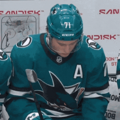 Hockey Player Number 71 Looking Down GIF