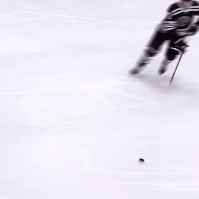 Hockey Player Number 72 Holding Puck GIF