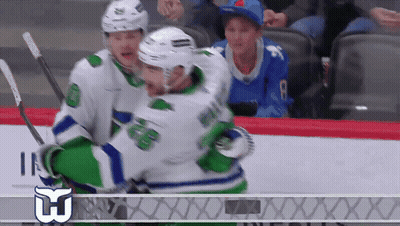 Hockey Player Number 8 Hugged By Another Player GIF