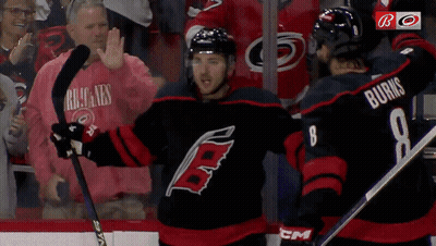 Hockey Player Number 8 Next To Another Player GIF