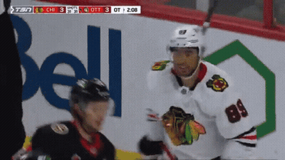 Hockey Player Number 84 In Front Of Bell Ad GIF