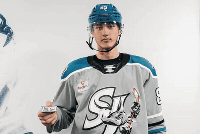 Hockey Player Number 85 Holding Paper GIF