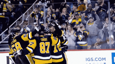 Hockey Player Number 87 Surrounded By Teammates GIF