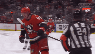 Hockey Player Number 9 Next To Referee 24 GIF