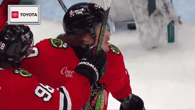 Hockey Player Number 98 Hugging Another Player GIF