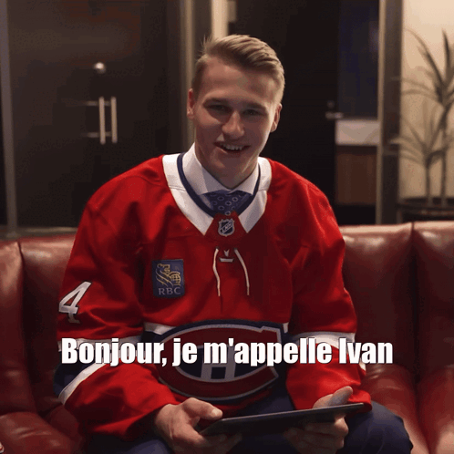 Hockey Player On Couch Holding Tablet Bonjour Je M'appelle Ivan GIF