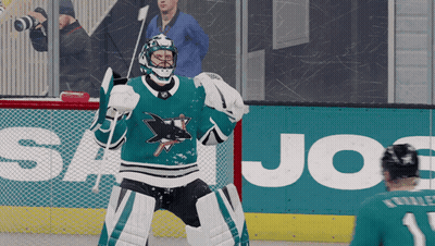 Hockey Player On Ice In Front Of Joe's Advertisement GIF