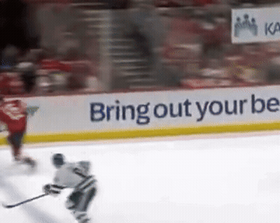 Hockey Player On Ice With Bring Out Your Bee Banner GIF