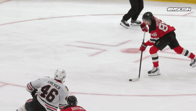 Hockey Player On Ice With Goal Banner GIF