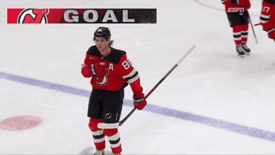 Hockey Player On Ice With Goal Banner GIF