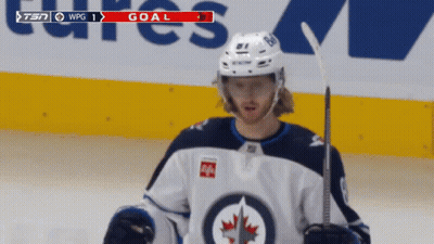 Hockey Player On Ice With Goal On Screen GIF