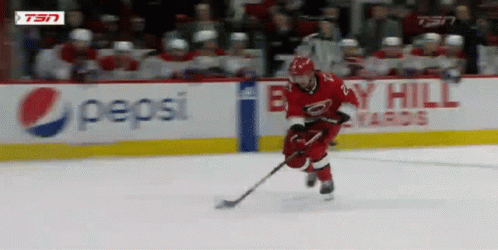 Hockey Player On Ice With Pepsi Sign GIF
