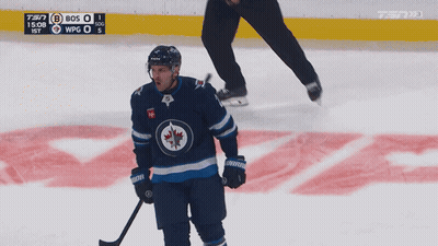 Hockey Player On Ice With Puck And Scoreboard 7:37 GIF