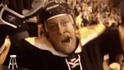 Hockey Player Raising Arms In Helmet GIF