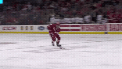 Hockey Player Skating In Front Of CCM Banner GIF