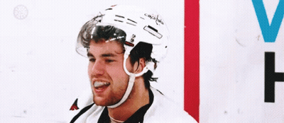 Hockey Player Smiling On Ice GIF