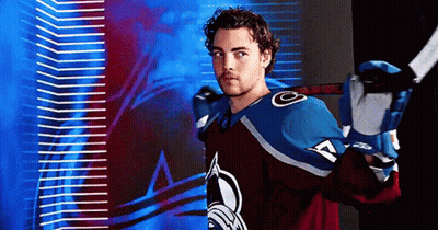 Hockey Player Smiling With Stick GIF