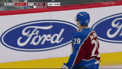 Hockey Player Standing In Front Of Ford Logo GIF