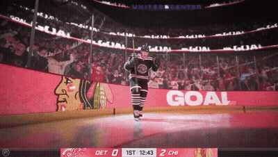 Hockey Player Stands On Ice In Front Of Goal Banner GIF
