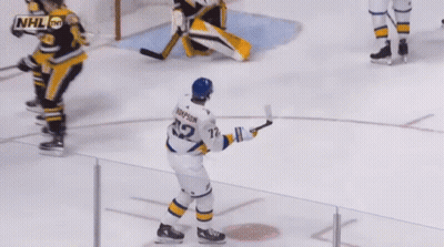 Hockey Player Thompson Holding Puck GIF