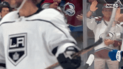 Hockey Player Waving In White Jersey GIF