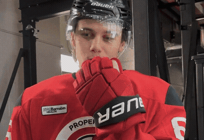 Hockey Player Wearing Bauer Helmet And Gloves GIF