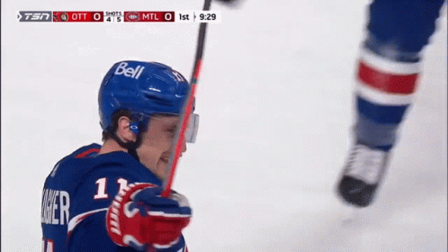 Hockey Player Wearing Bell Helmet Holding Stick GIF