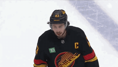 Hockey Player Wearing Helmet And C Jersey GIF