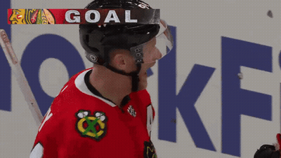 Hockey Player Wearing Helmet Saying Goal GIF