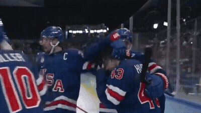 Hockey Player Wearing Number 10 Hugging GIF